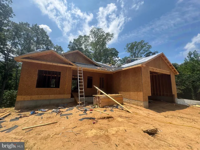 a front of a building with a street sign