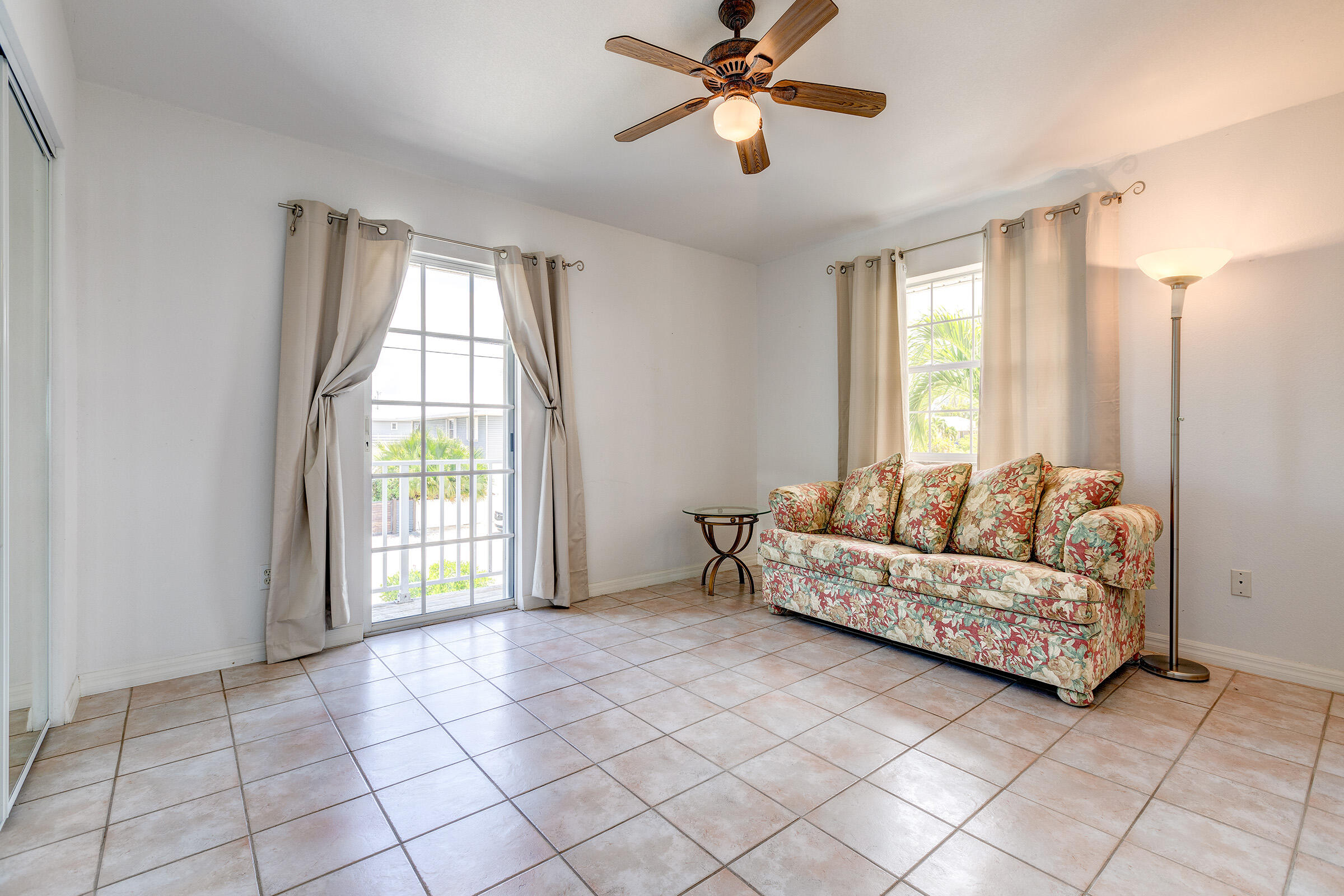22808 Privateer Drive Cudjoe, FL 33042 - Photo 13 of 28 a living room with furniture and a window
