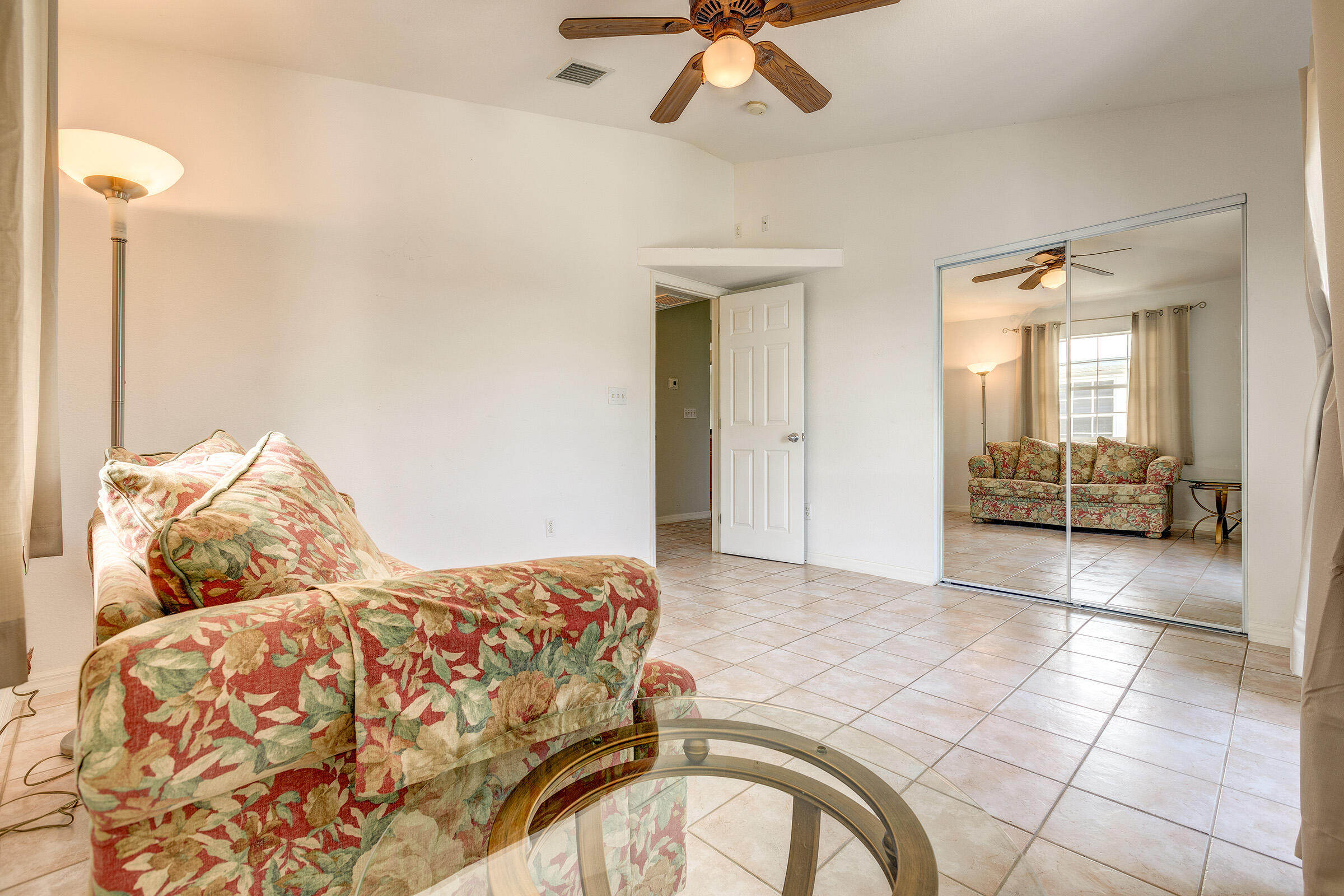 22808 Privateer Drive Cudjoe, FL 33042 - Photo 14 of 28 a bedroom with a bed and a mirror