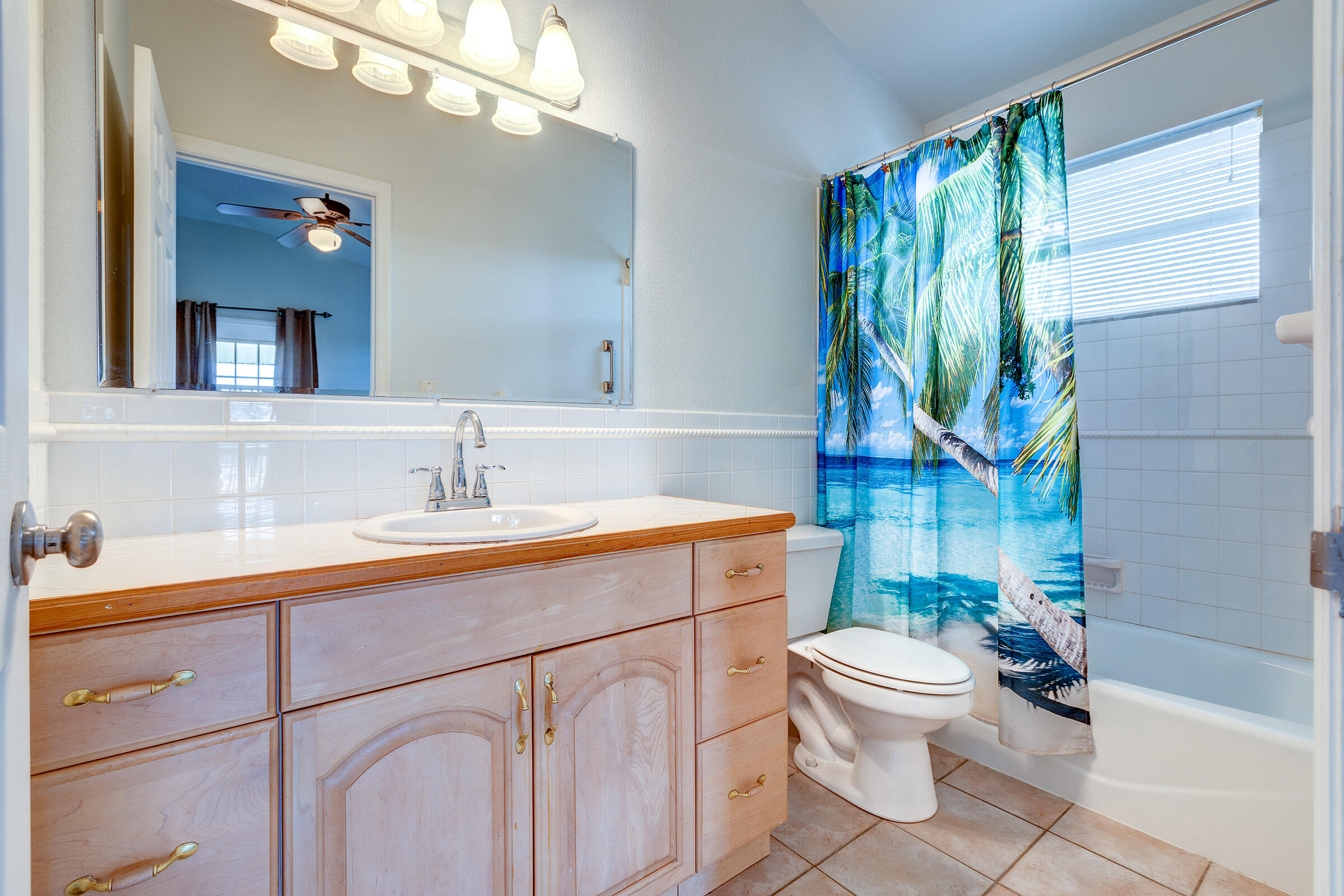 22808 Privateer Drive Cudjoe, FL 33042 - Photo 17 of 28 a bathroom with a sink a toilet and a bathtub