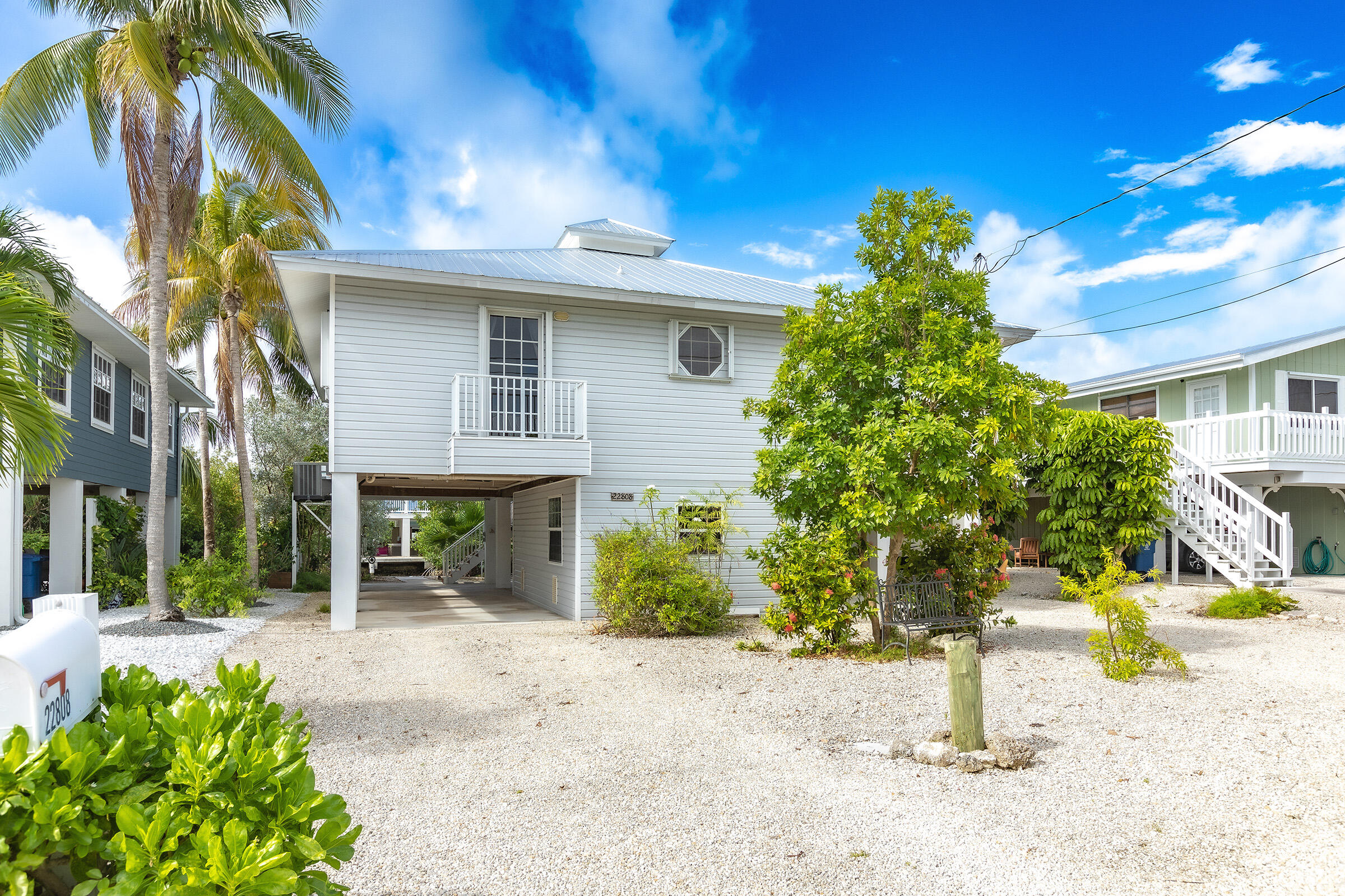 22808 Privateer Drive Cudjoe, FL 33042 - Photo 2 of 28 a front view of a house with a yard