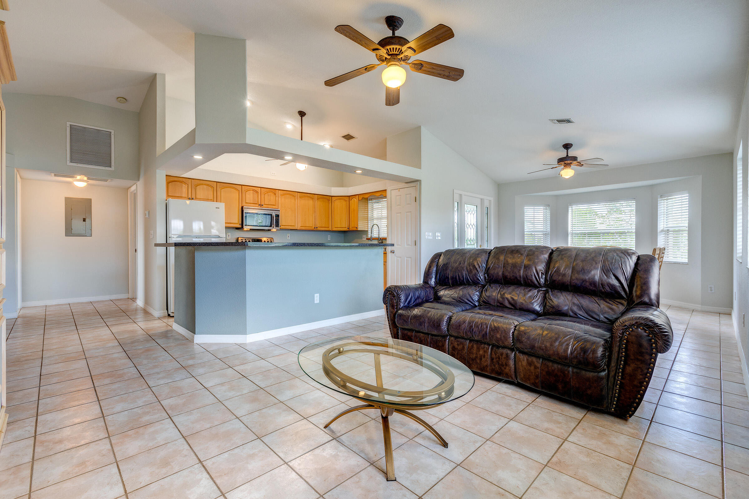 22808 Privateer Drive Cudjoe, FL 33042 - Photo 3 of 28 a living room with furniture and a chandelier