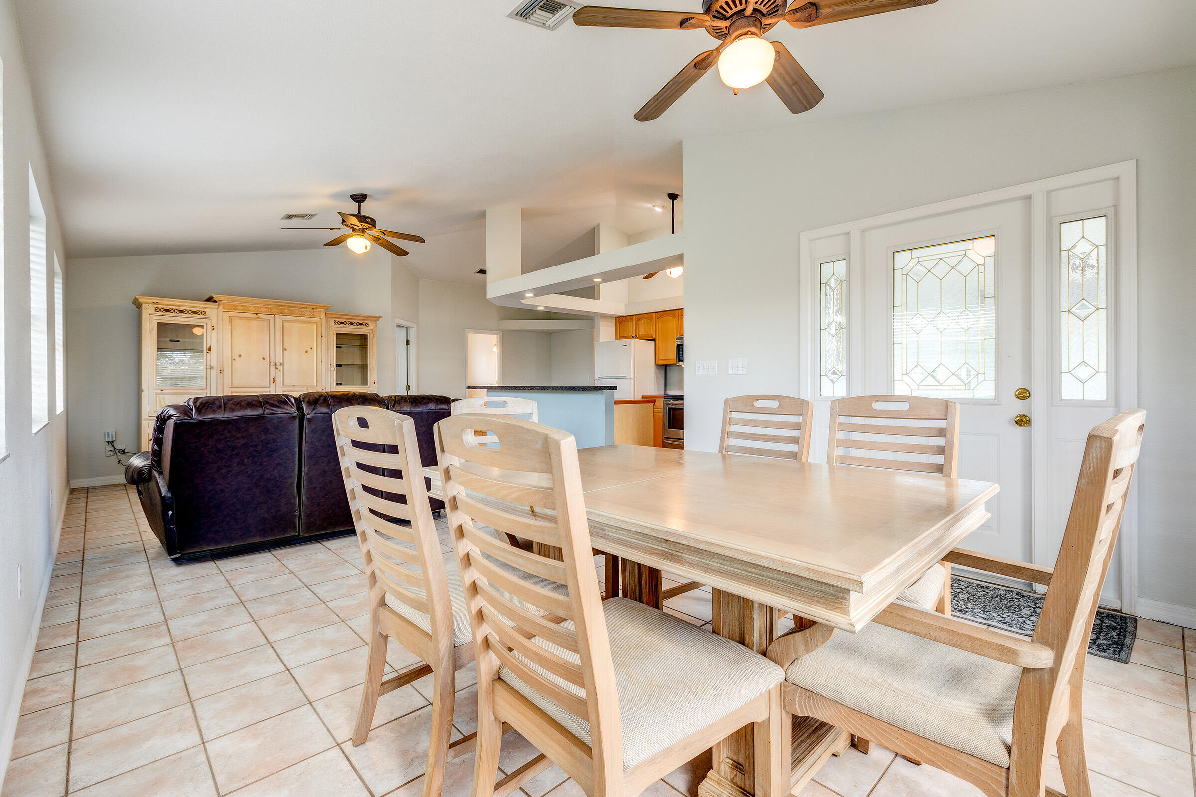 22808 Privateer Drive Cudjoe, FL 33042 - Photo 5 of 28 a living room with furniture and a chandelier