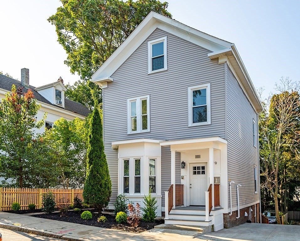 49 Alpine Street, Unit 2 Boston, MA 02119 - Photo 16 of 18 a front view of a house with a yard