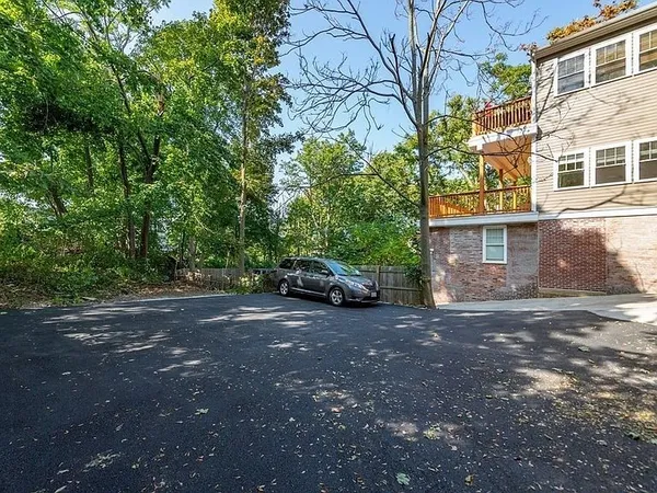 a view of a car parked in front of a building