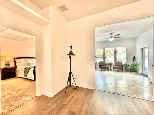 a kitchen with granite countertop a refrigerator a stove and a sink