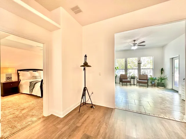 a kitchen with granite countertop a refrigerator a stove and a sink