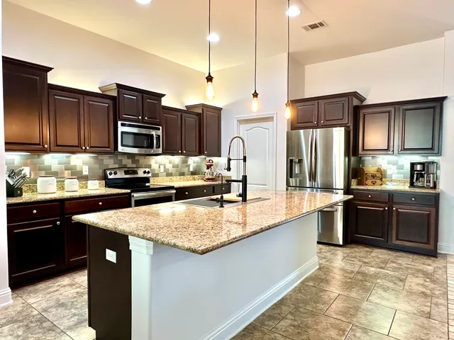 a spacious bedroom with a bed and a window