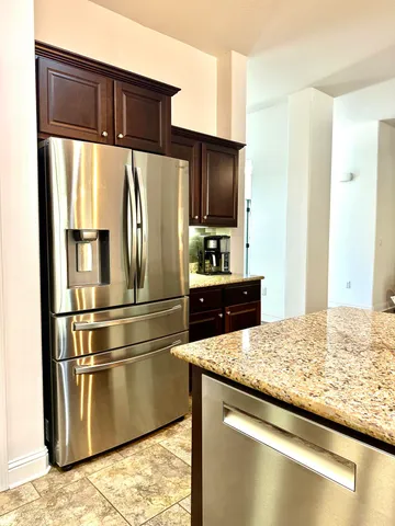 a bed in a bedroom next to a window