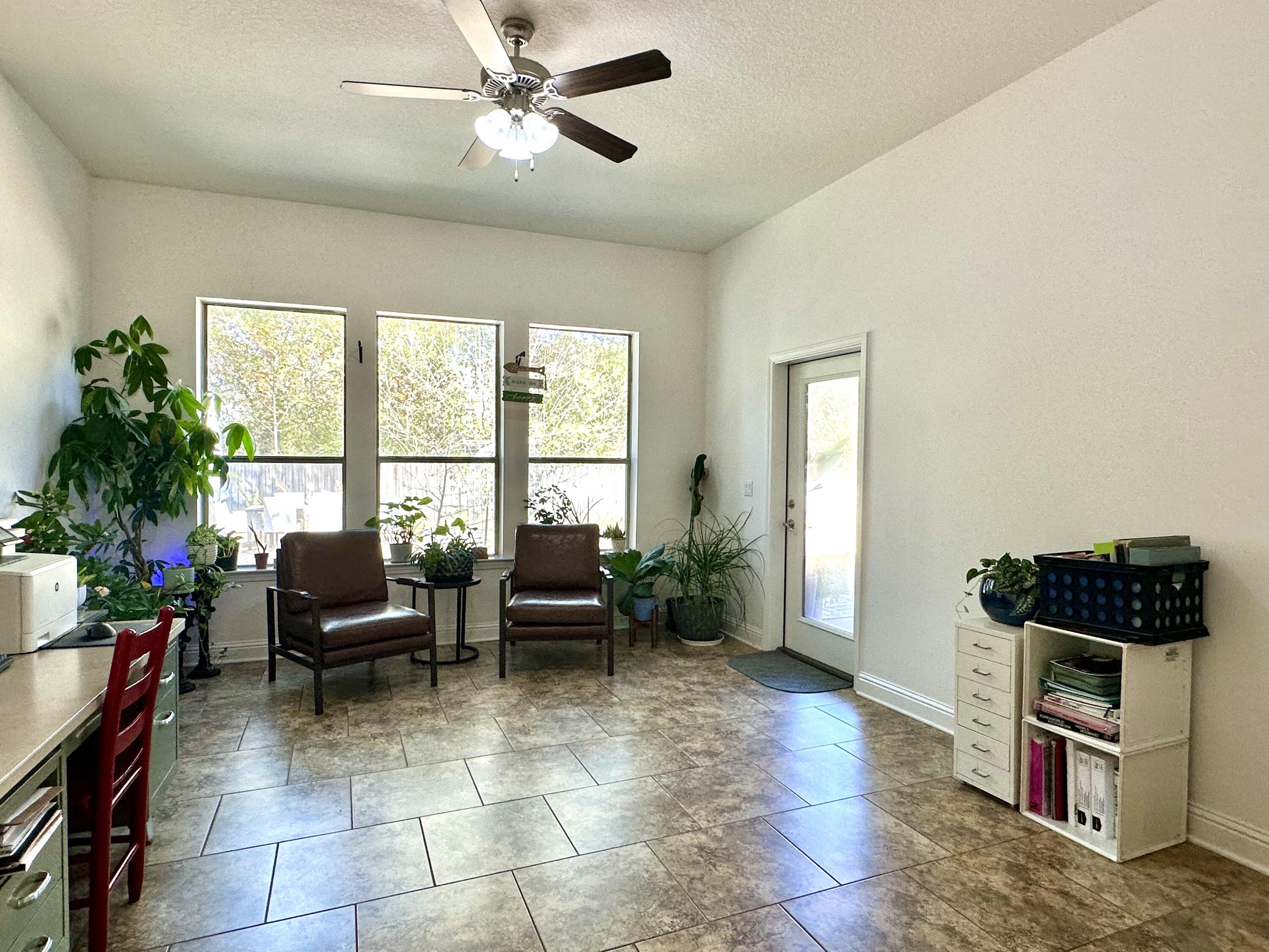 5930 Wind Trace Road Crestview, FL 32536 - Photo 28 of 68 a living room with furniture and a window