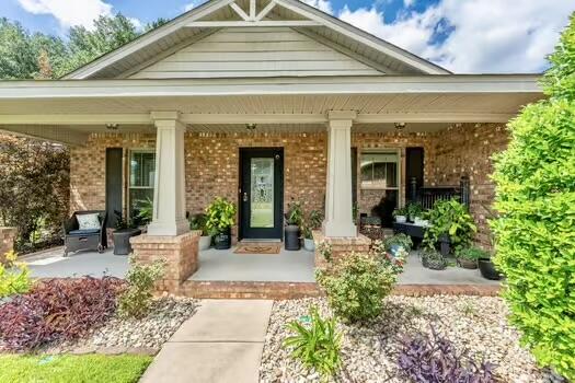 5930 Wind Trace Road Crestview, FL 32536 - Photo 3 of 68 a front view of a house with garden