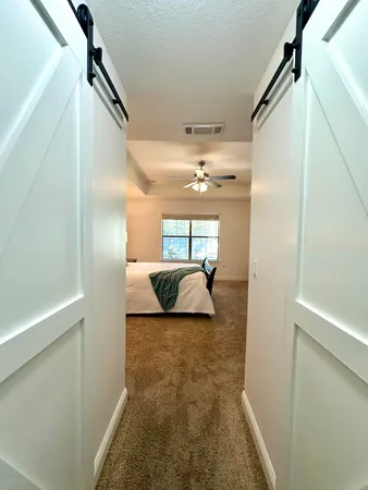 a bedroom with bed and window