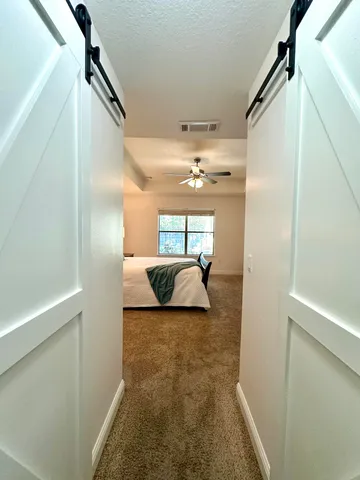 a bedroom with bed and window