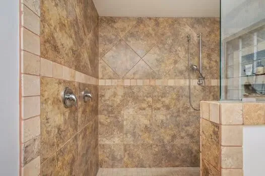 a bathroom with a shower and a tub