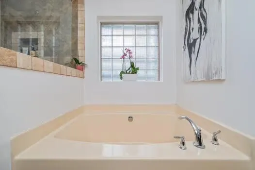 a bathroom with a sink vanity and a mirror