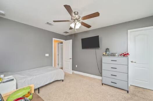 5930 Wind Trace Road Crestview, FL 32536 - Photo 47 of 68 a bedroom with a bed and a flat screen tv