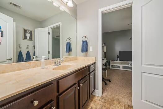 5930 Wind Trace Road Crestview, FL 32536 - Photo 49 of 68 a bathroom with a sink a vanity and a mirror