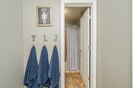 5930 Wind Trace Road Crestview, FL 32536 - Photo 50 of 68 a view of walk in closet with clothes