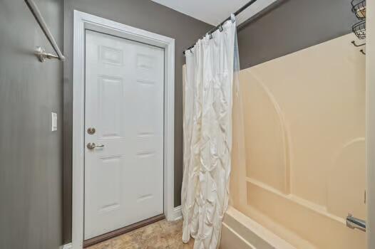 5930 Wind Trace Road Crestview, FL 32536 - Photo 51 of 68 a bathroom with a shower and a tub