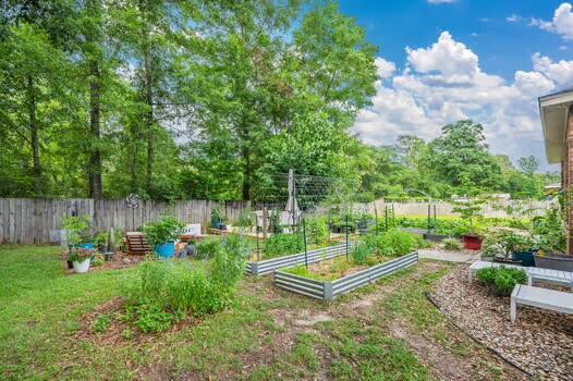 5930 Wind Trace Road Crestview, FL 32536 - Photo 56 of 68 a view of a backyard with sitting area