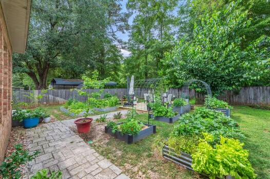 5930 Wind Trace Road Crestview, FL 32536 - Photo 59 of 68 a view of a backyard with furniture and garden