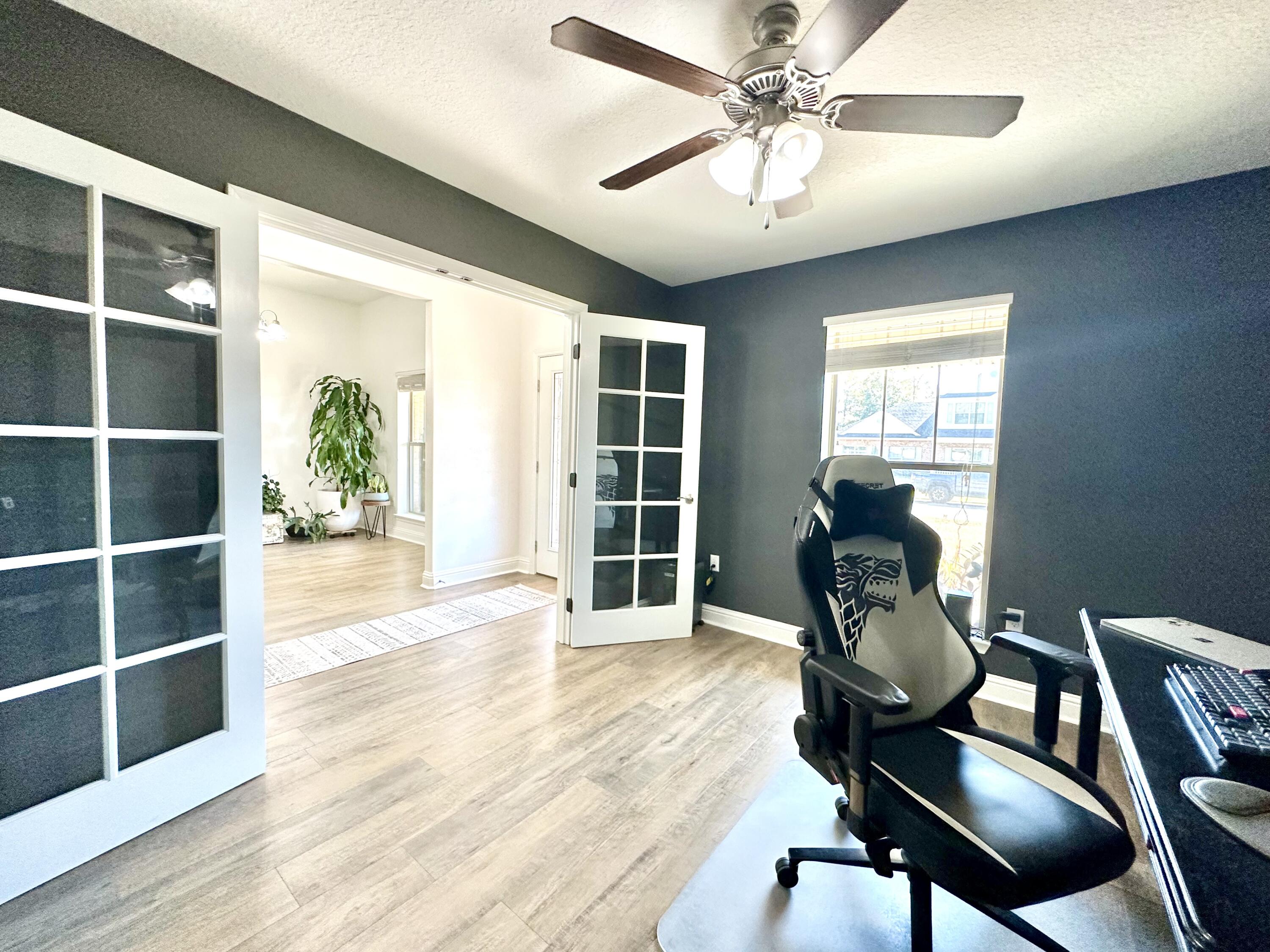 5930 Wind Trace Road Crestview, FL 32536 - Photo 6 of 68 a view of a workspace with furniture and a window