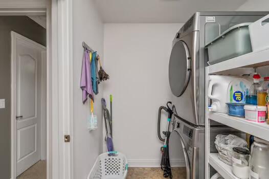 5930 Wind Trace Road Crestview, FL 32536 - Photo 63 of 68 a view of walk in closet with clothes and shoes