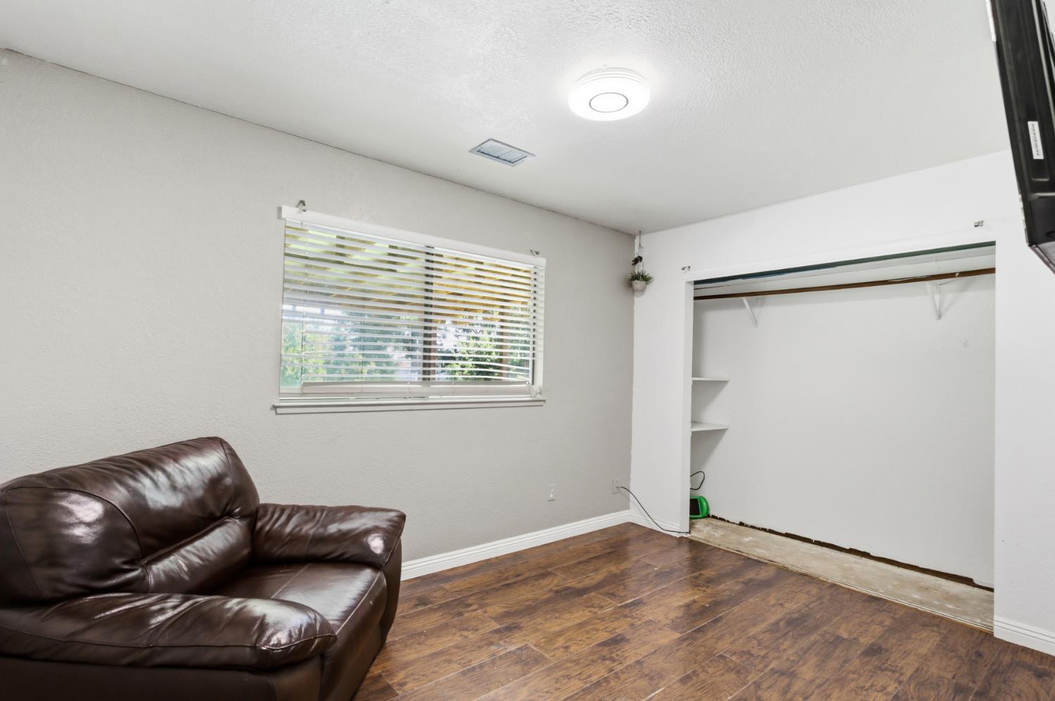 7208 7th Street Rio Linda, CA 95673 - Photo 21 of 41 a living room with furniture and a window