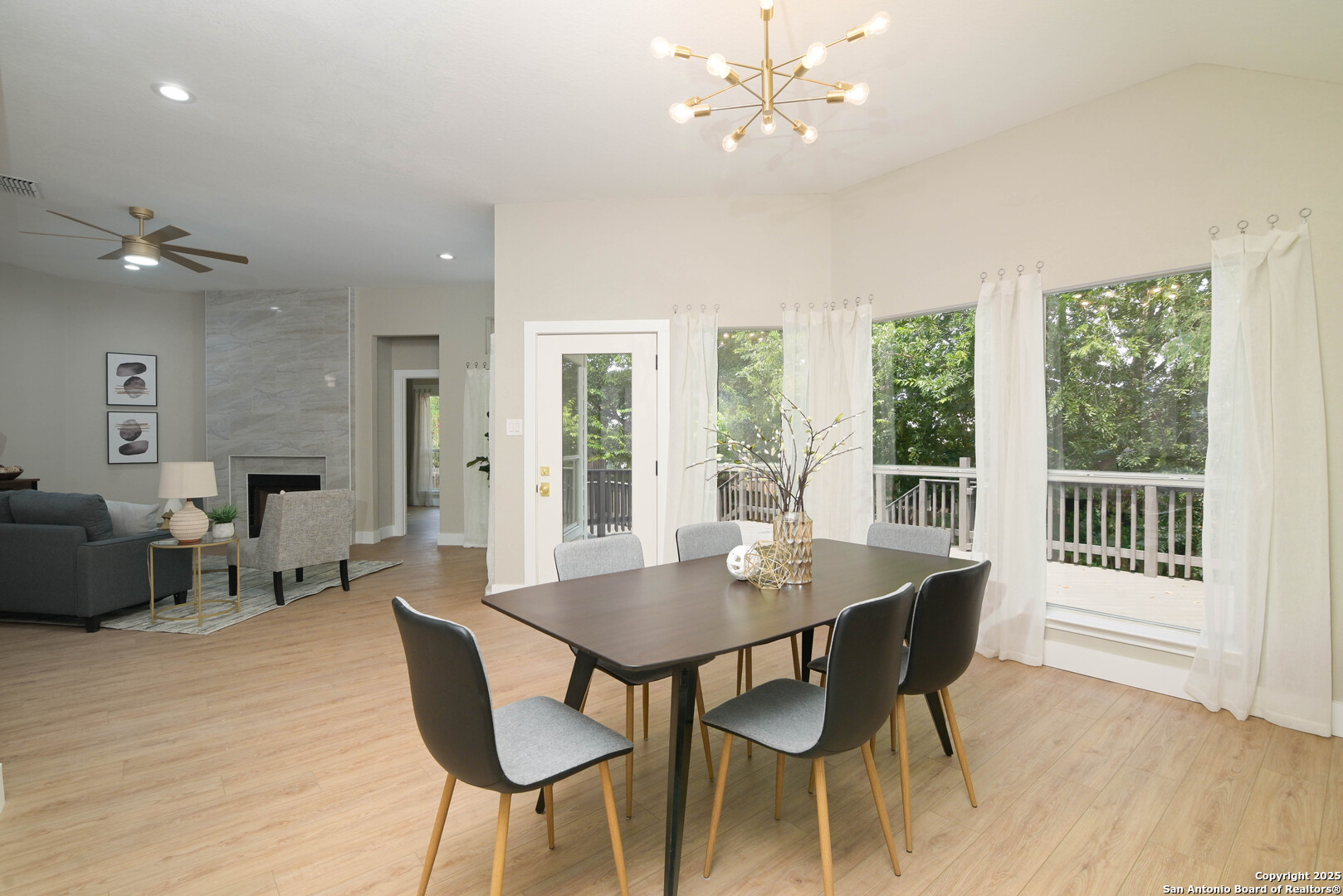 2155 North Ranch Estates Boulevard New Braunfels, TX 78130 - Photo 12 of 28 a view of a dining room with furniture window and wooden floor
