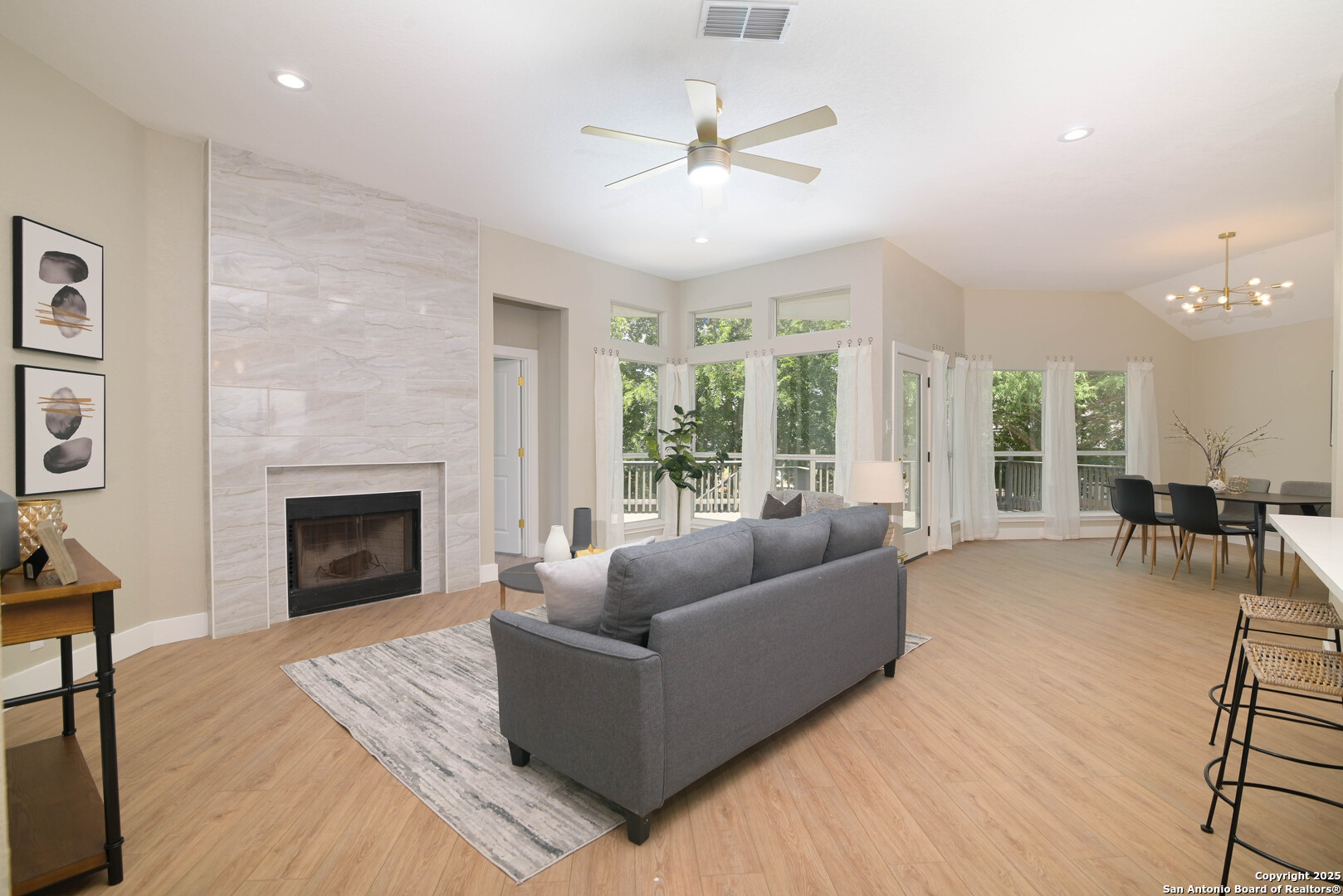 2155 North Ranch Estates Boulevard New Braunfels, TX 78130 - Photo 14 of 28 a living room with furniture and a fireplace