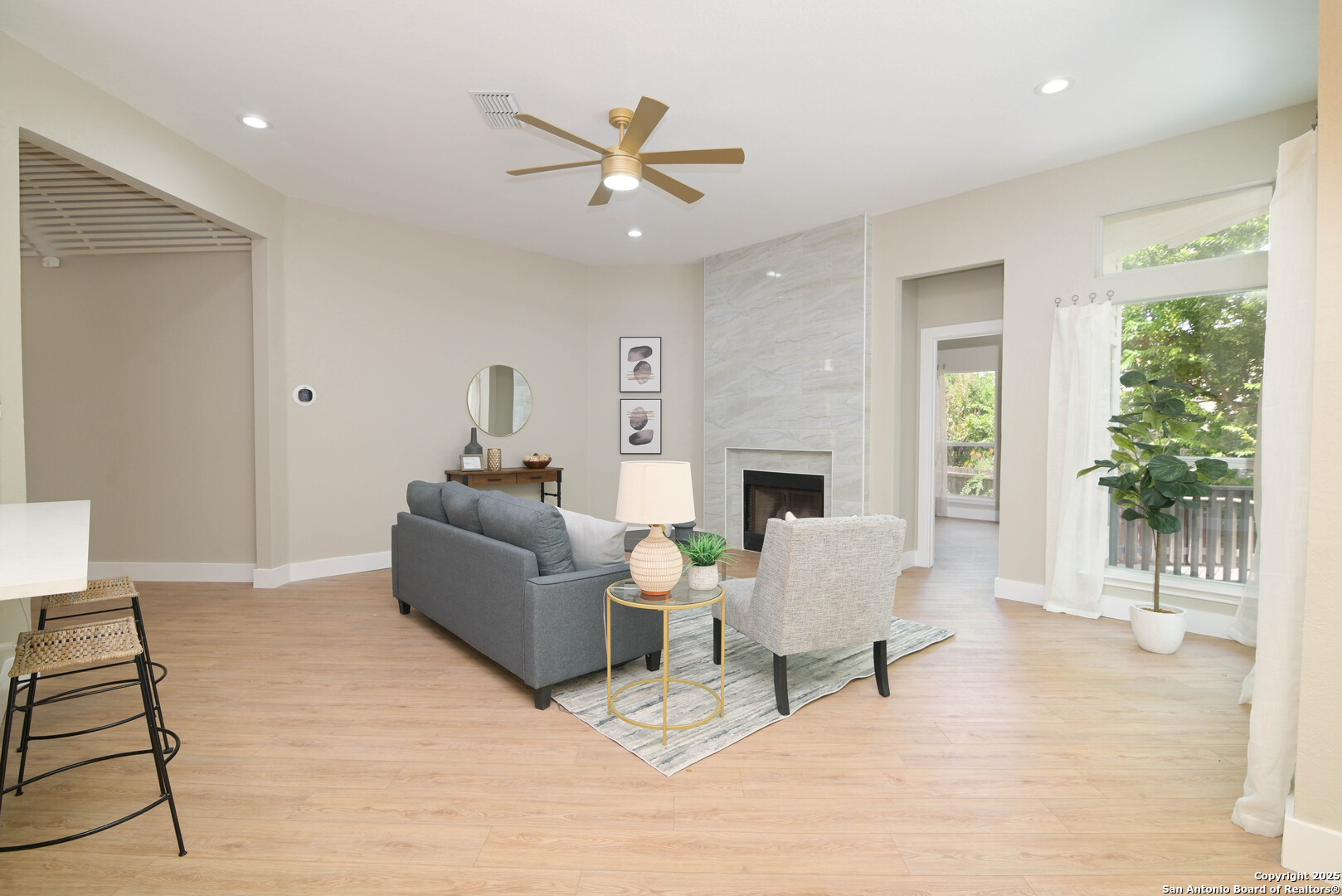 2155 North Ranch Estates Boulevard New Braunfels, TX 78130 - Photo 15 of 28 a living room with furniture and a fireplace