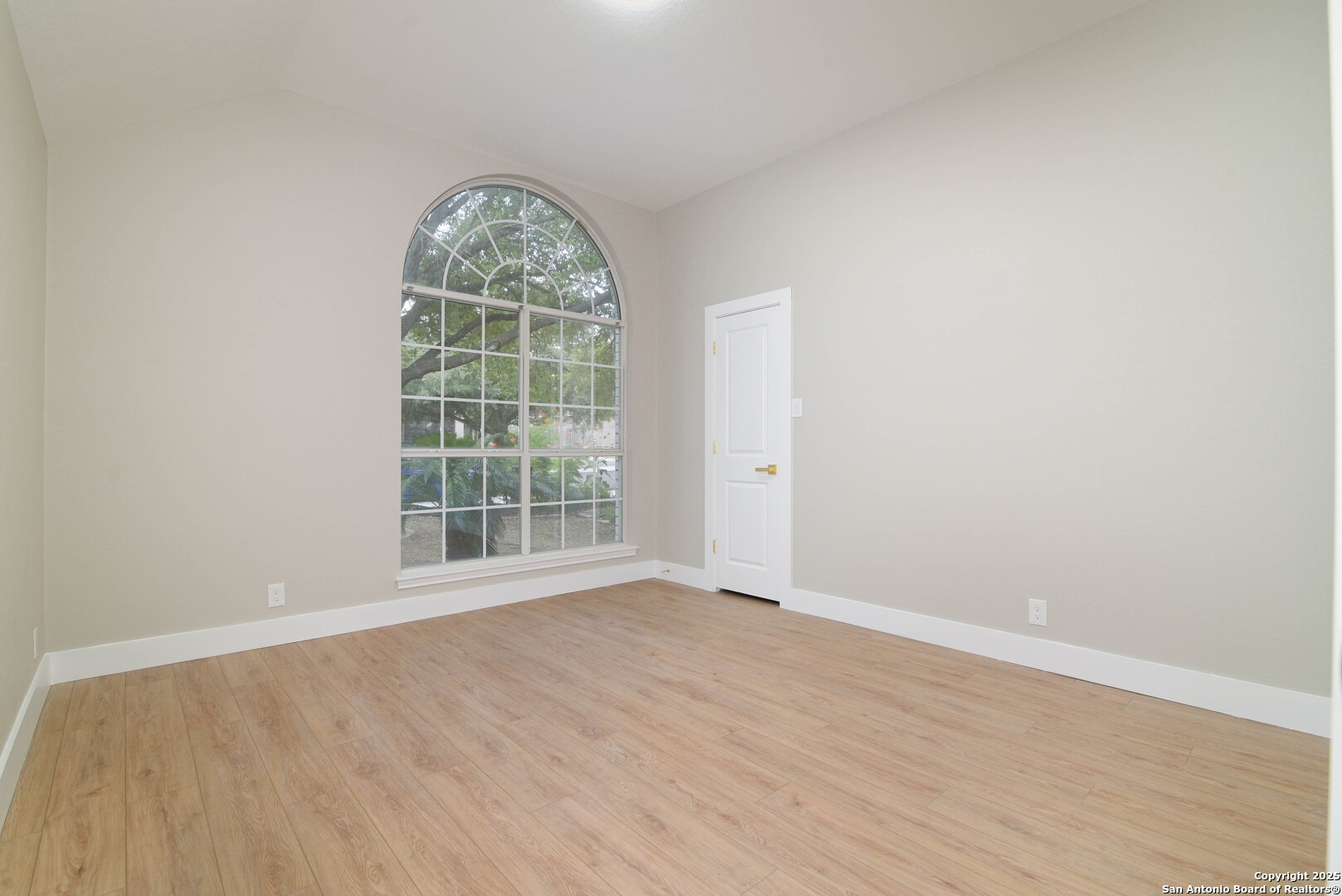 2155 North Ranch Estates Boulevard New Braunfels, TX 78130 - Photo 17 of 28 an empty room with wooden floor and windows