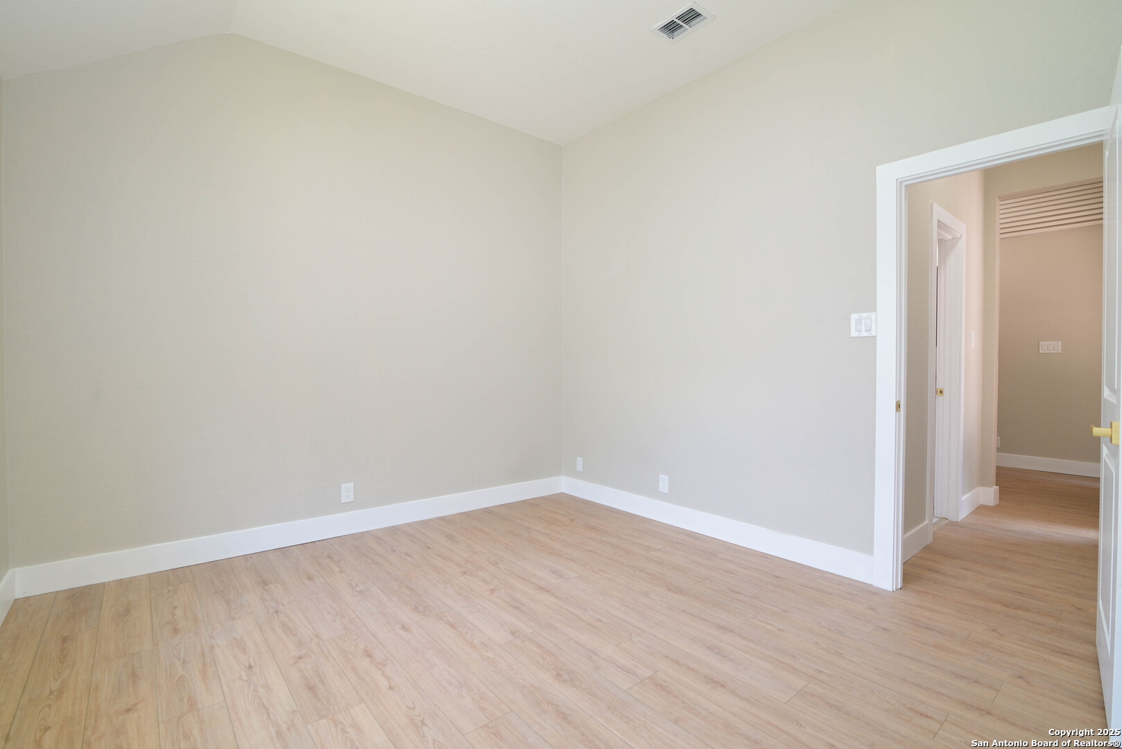 2155 North Ranch Estates Boulevard New Braunfels, TX 78130 - Photo 19 of 28 a view of an empty room with wooden floor