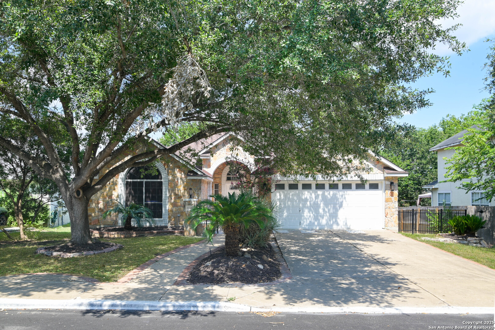 2155 North Ranch Estates Boulevard New Braunfels, TX 78130 - Photo 24 of 28 a front view of a house with a yard and tree s