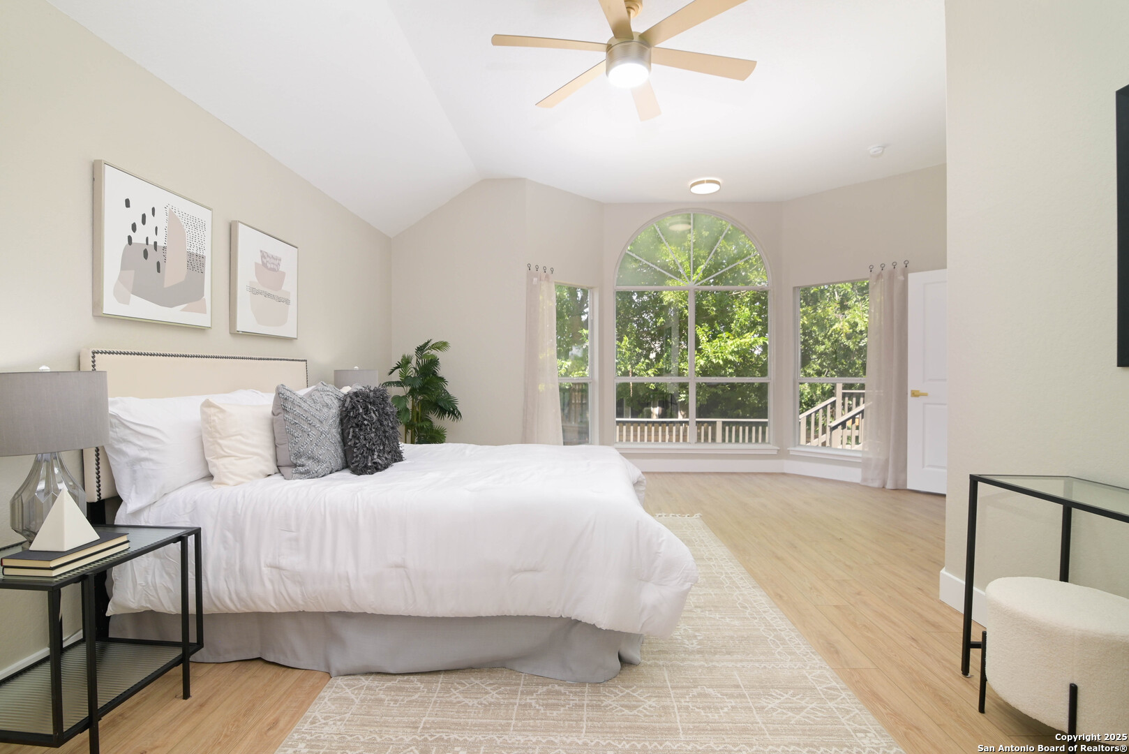 2155 North Ranch Estates Boulevard New Braunfels, TX 78130 - Photo 6 of 28 a bedroom with a large bed and a chandelier