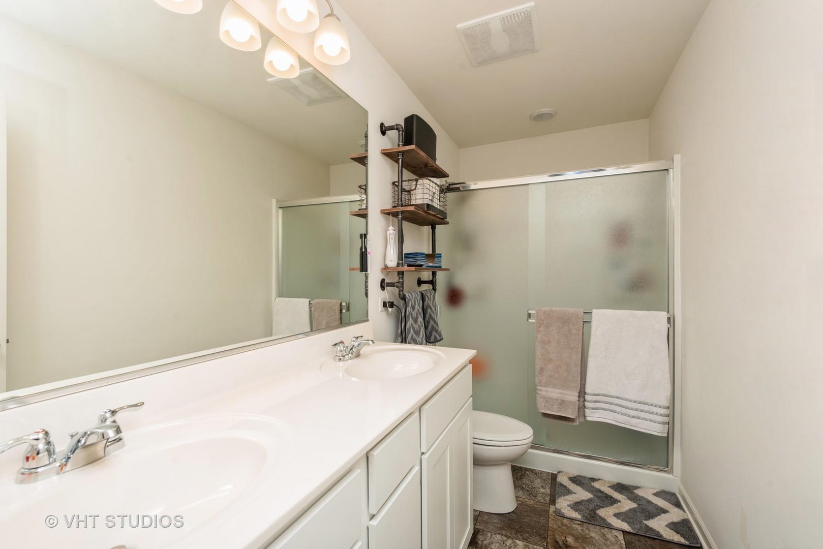 2403 Upland Road Pingree Grove, IL 60140 - Photo 9 of 15 a bathroom with a sink a toilet and shower