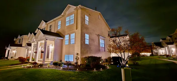 a front view of a house with a yard