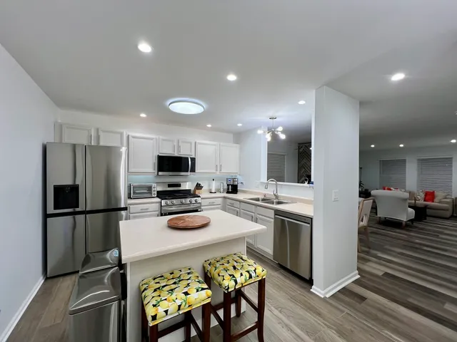 a bedroom with a bed and a ceiling fan