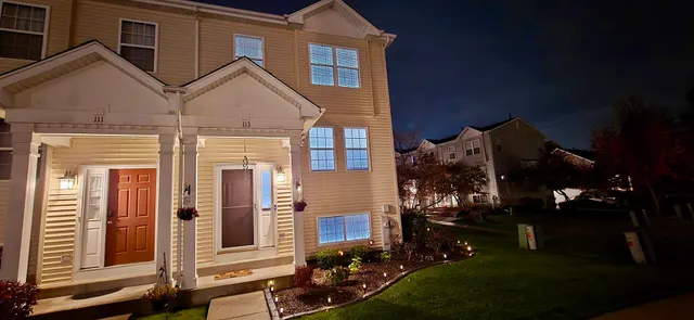 a kitchen with a stove a refrigerator and a microwave