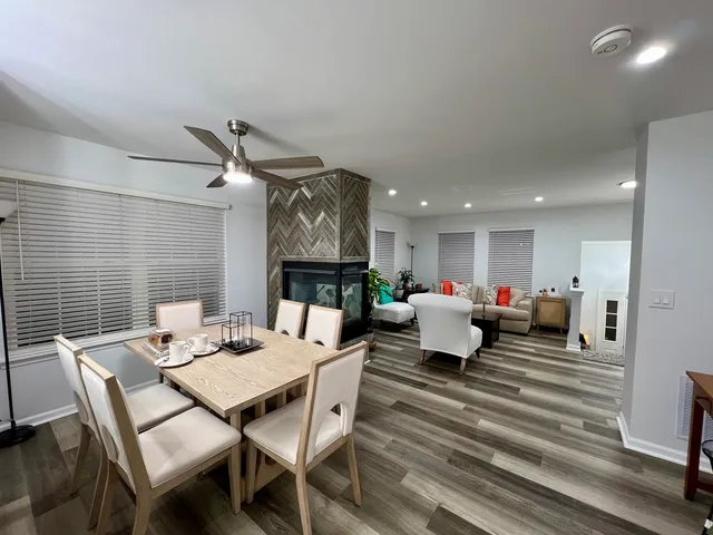 a kitchen with stainless steel appliances granite countertop a sink refrigerator stove and microwave