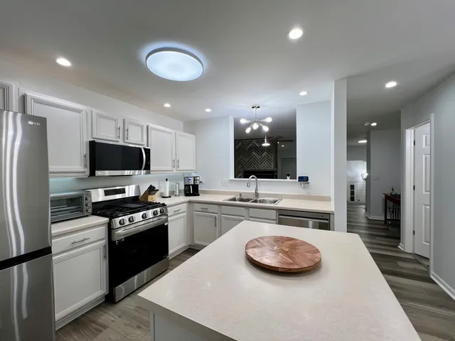a living room with furniture flower pot and a fireplace