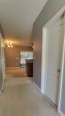 a view of empty room with a fireplace