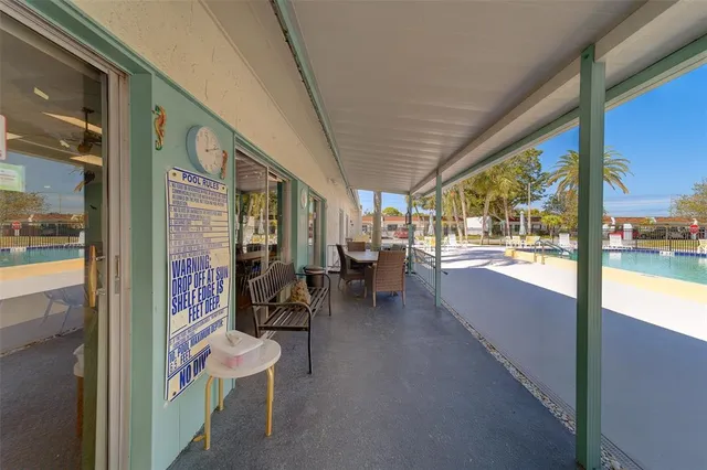 a view of swimming pool with chairs