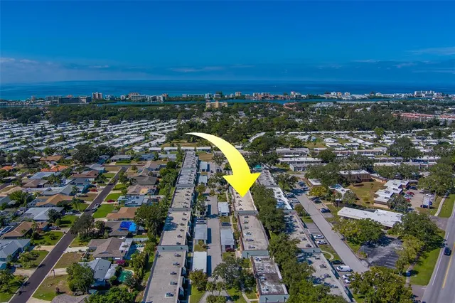an aerial view of house with a swimming pool yard and outdoor seating