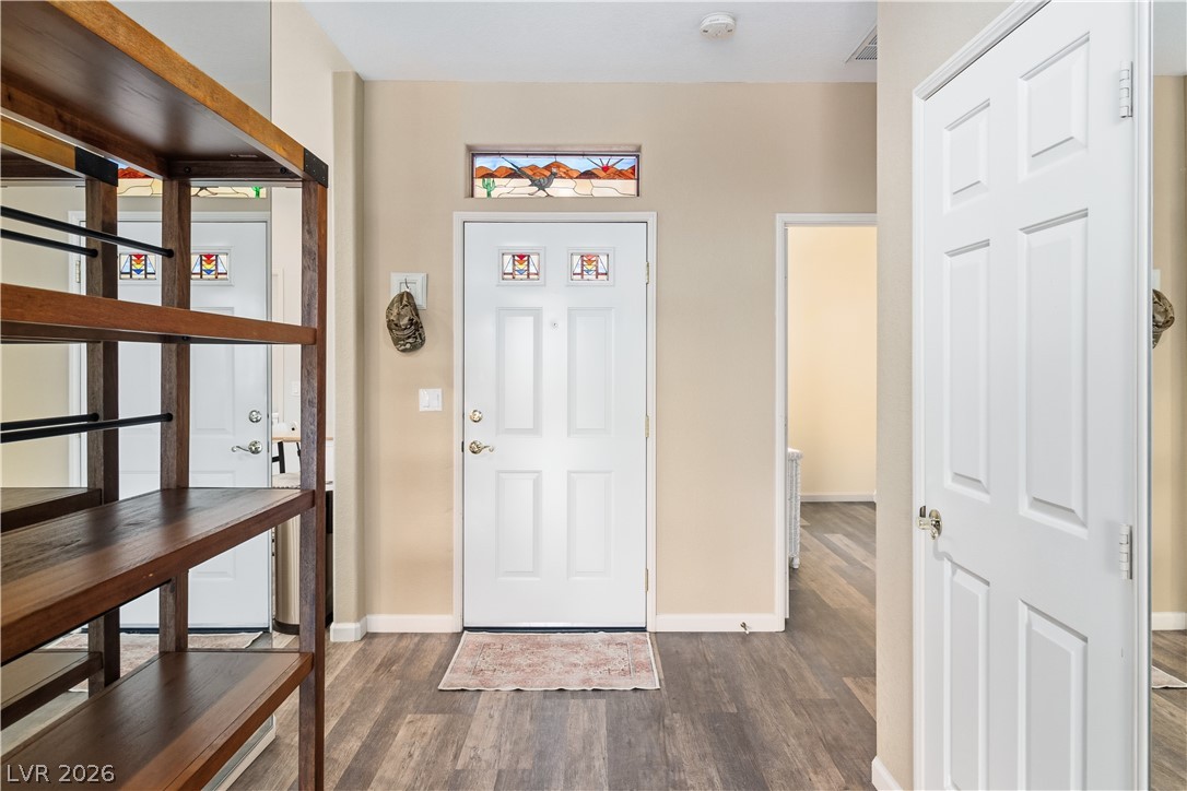 3350 Pheasant Canyon Way, Unit 1008 Laughlin, NV 89029 - Photo 5 of 80 Foyer entrance with dark wood-style floors and baseboards