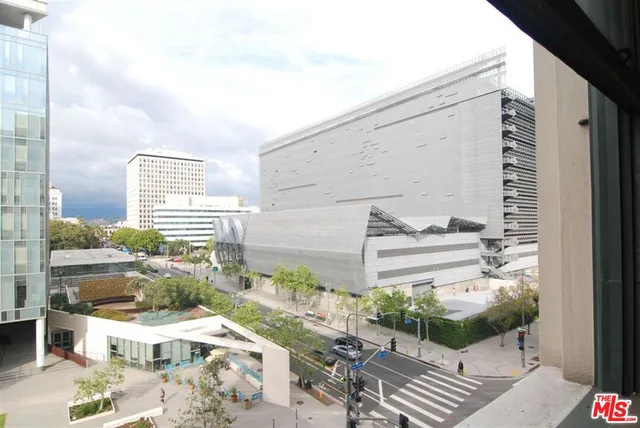 a view of a patio with couches and potted plants