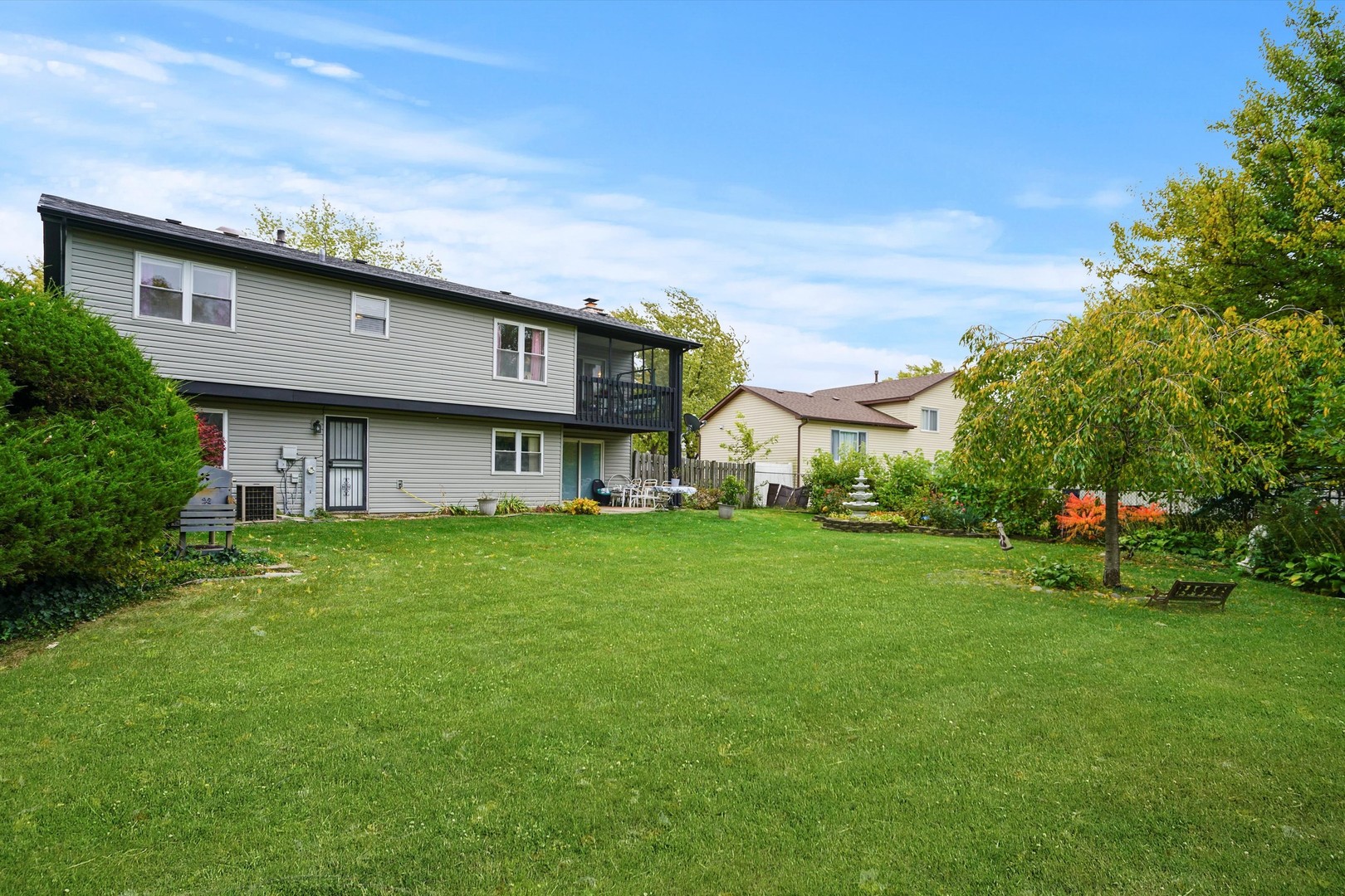 50 Cloverleaf Road Matteson, IL 60443 - Photo 3 of 19 a view of a big house with a big yard plants and large trees
