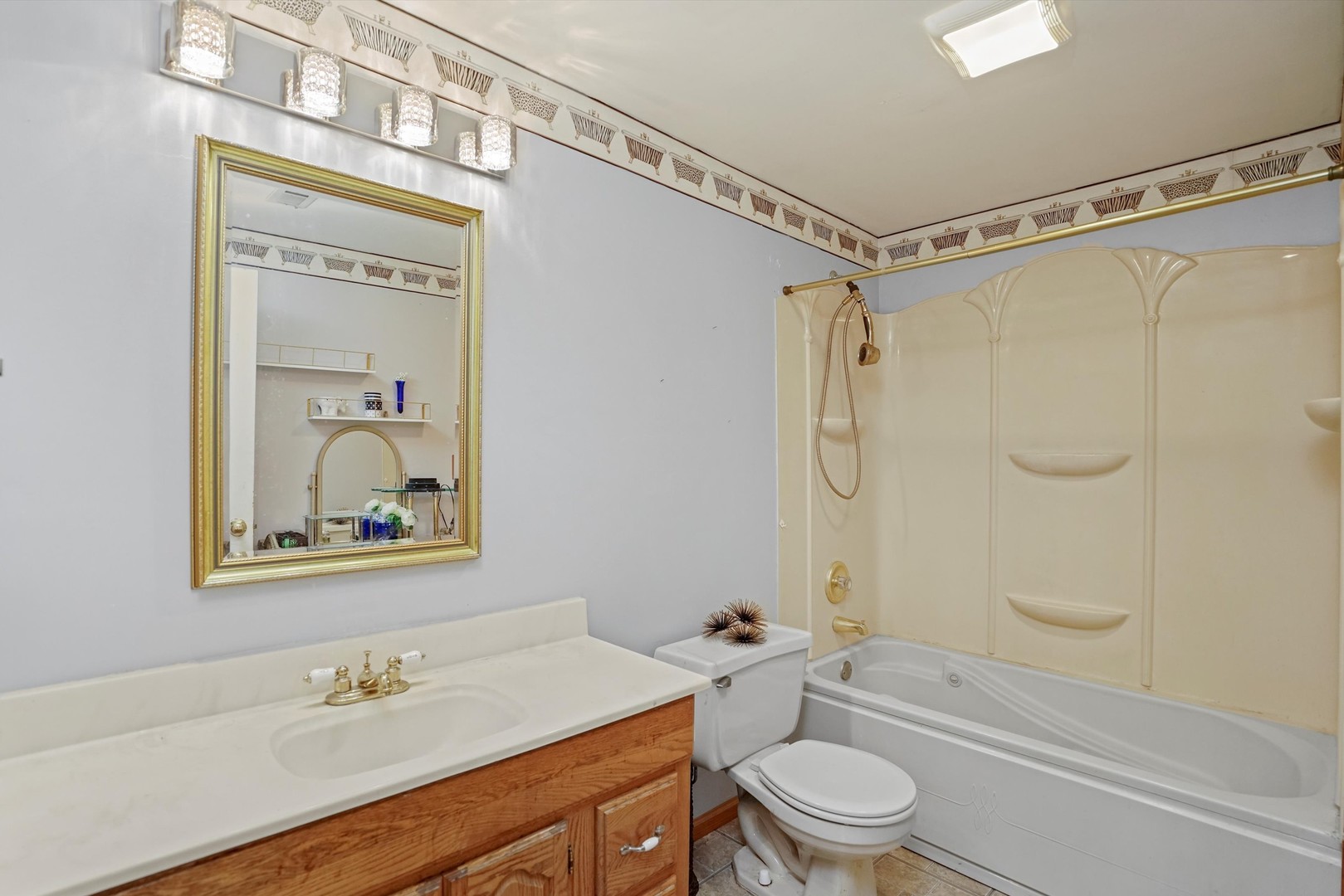 50 Cloverleaf Road Matteson, IL 60443 - Photo 10 of 19 a bathroom with a granite countertop sink a toilet and shower