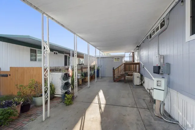 a view of a house with backyard and porch