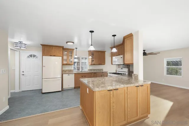 a view of a livingroom with a ceiling fan and a window